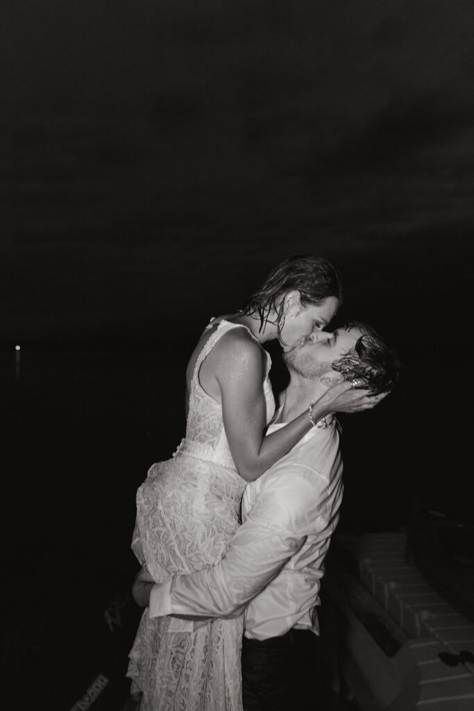 picture of the bride and groom kissing 