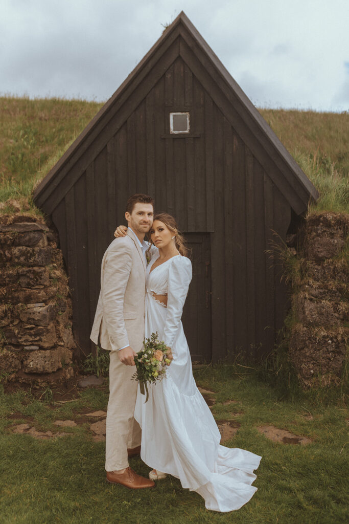 bride and groom looking at the camera during their photoshoot