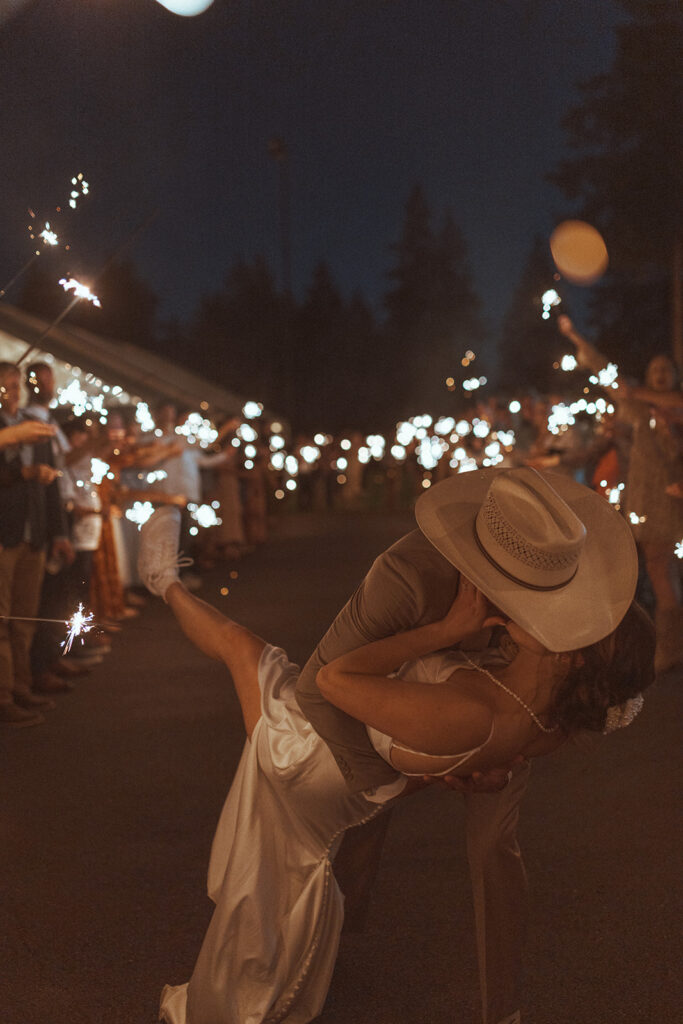 newlyweds kissing at their dream backyard wedding