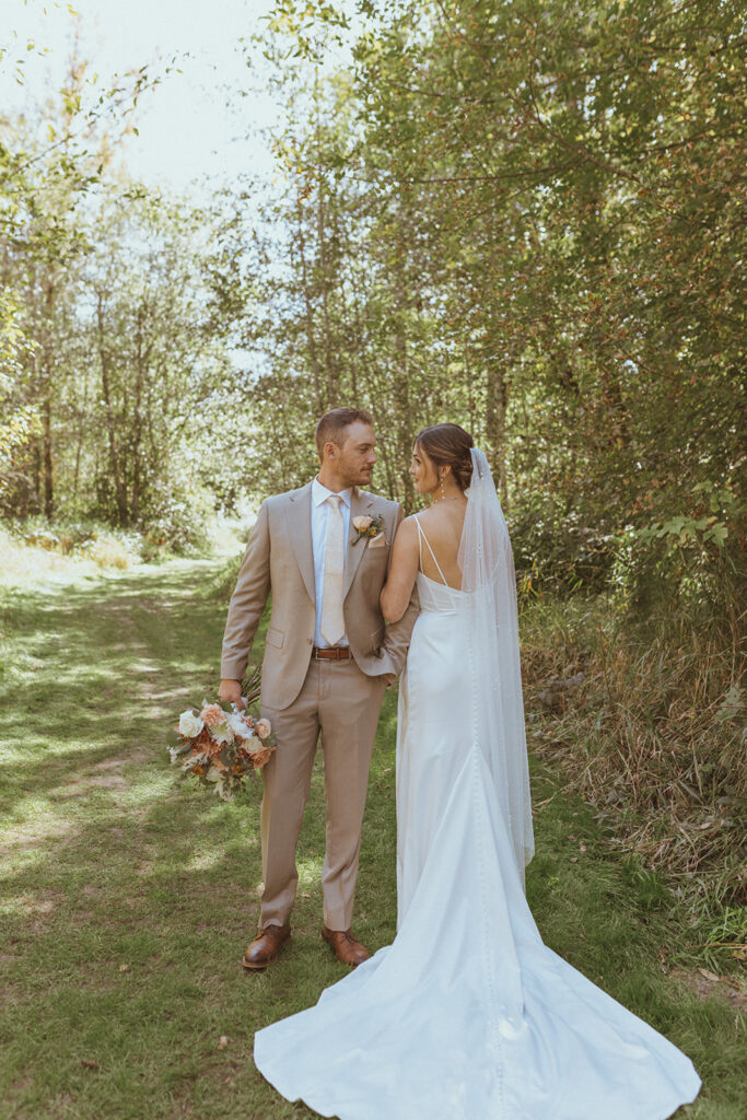 picture of the bride and groom holding hands