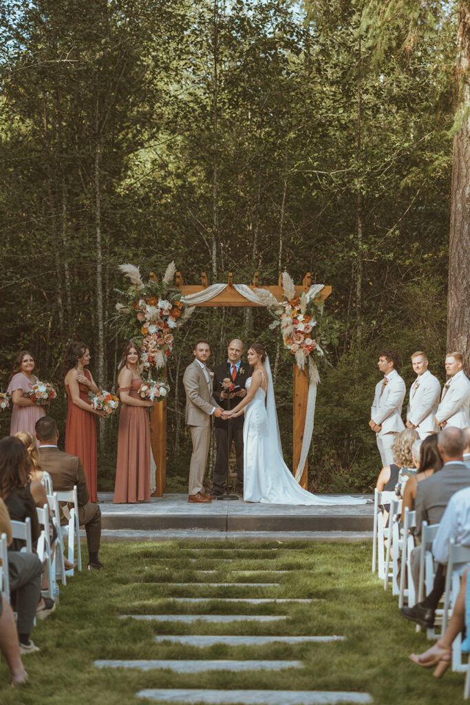 happy couple before heading to their reception