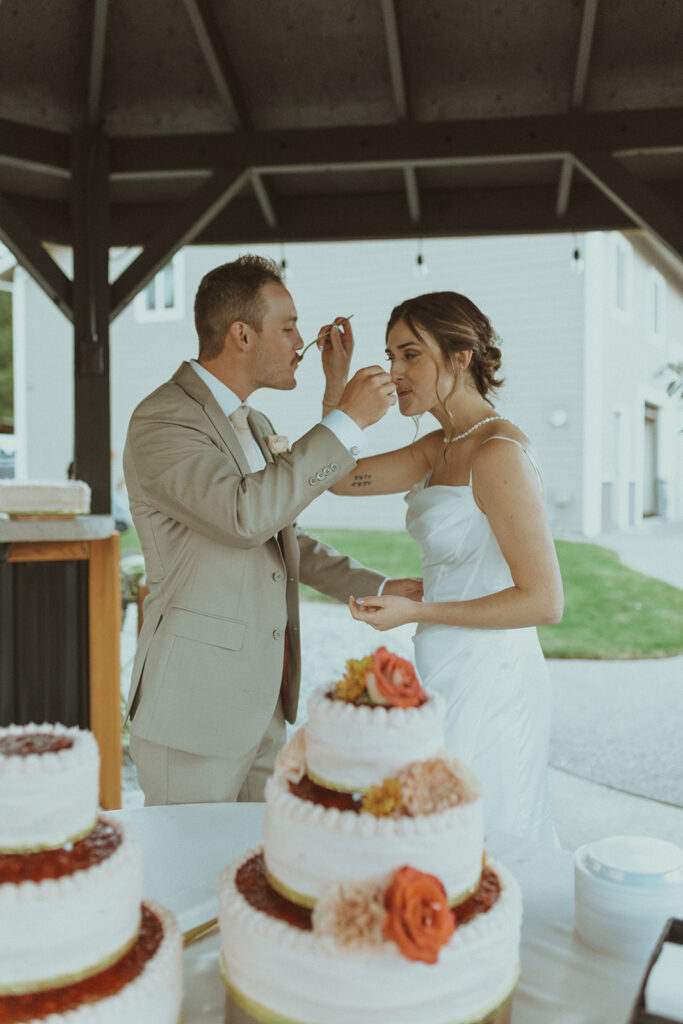 newlyweds trying their dream backyard wedding cake  